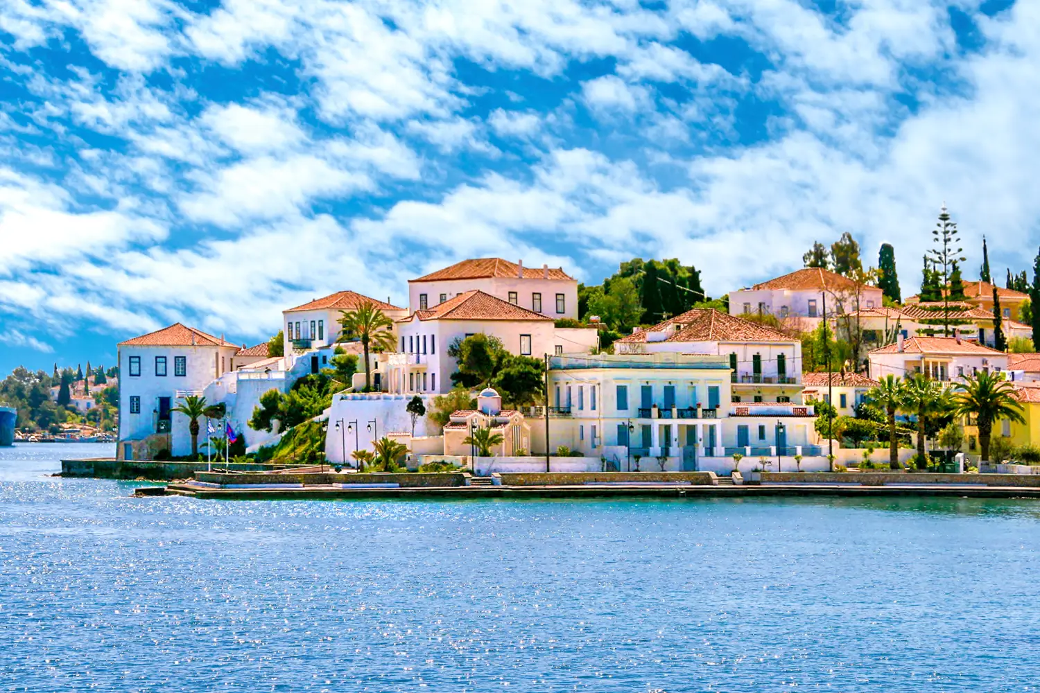 Ferry to Saronic Islands - Buildings of Spetses island on Saronic gulf near Athens. Ideal travel destination for quiet vacations, Greece