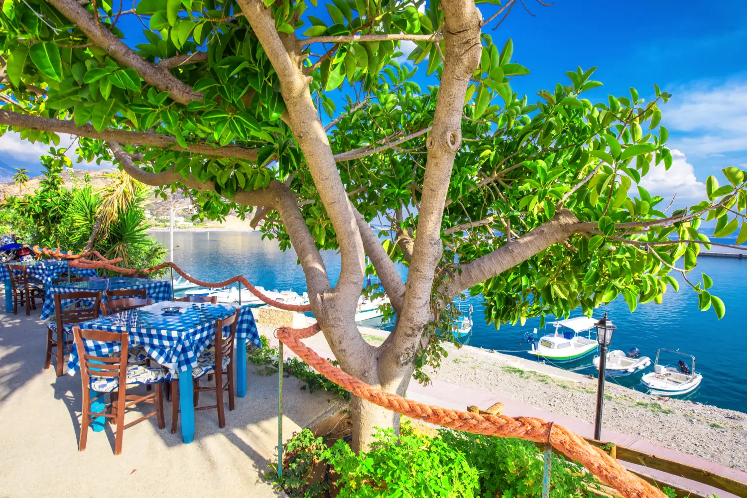 Ferry to Kasteli - Typical Greece restaurant on the beach, Creta, Greece, Europe.