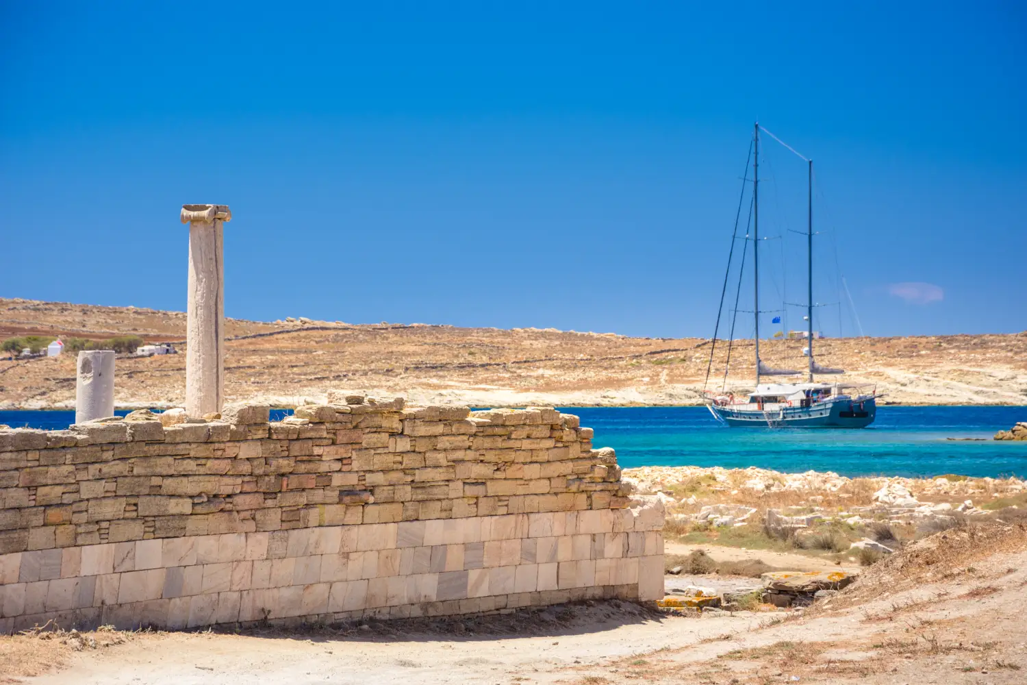 Ferry to Delos - Ancient ruins in the island of Delos in Cyclades, one of the most important mythological, historical and archaeological sites in Greece.