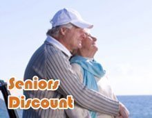 A senior couple is enjoying the ferry ride.