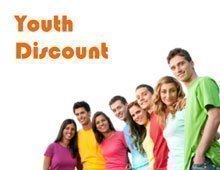 A group of youths with colorful t-shirts are looking into the camera lens.