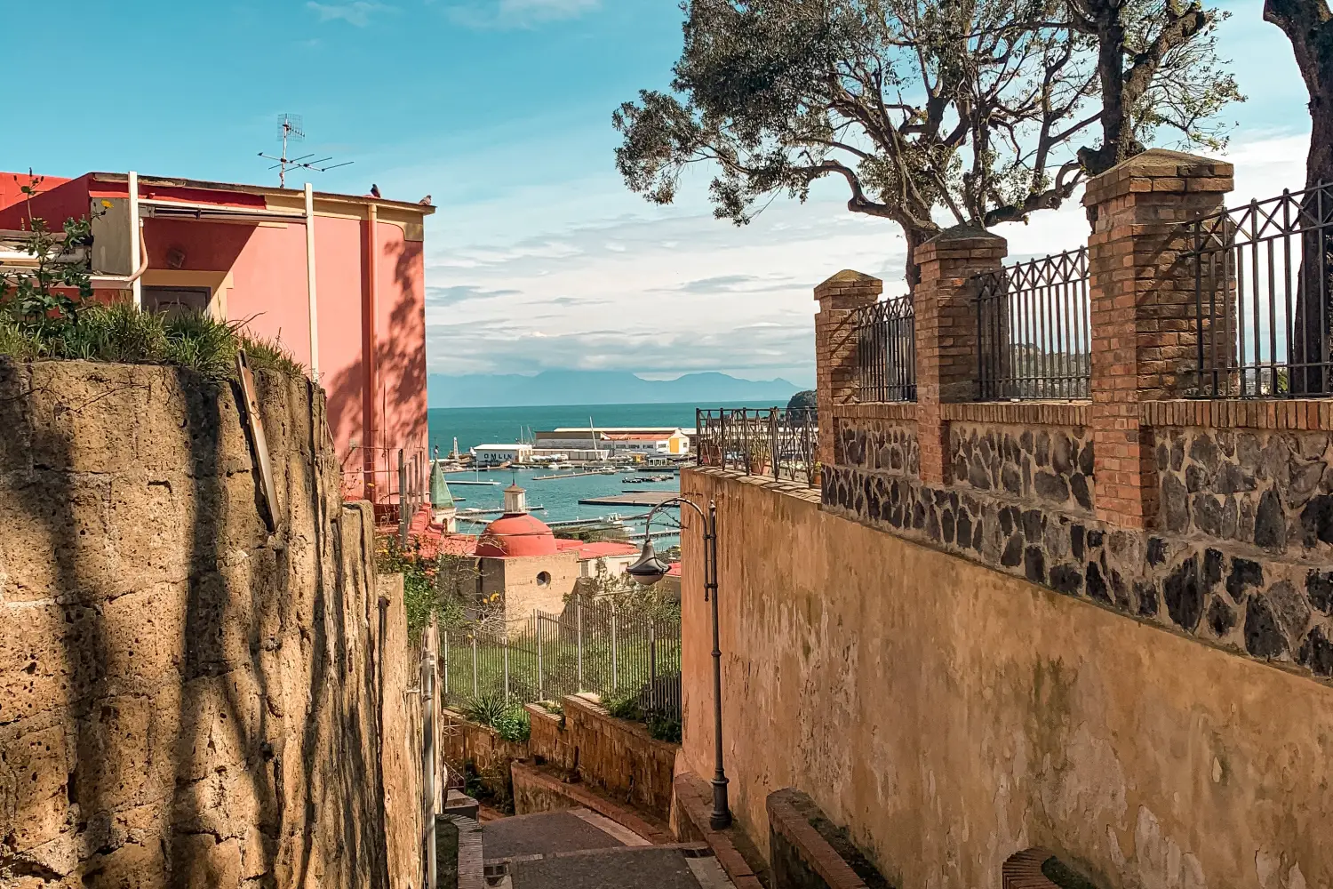 Ferry to Molo Beverello (Naples) - Narrow street in Naples, overlooking the port.