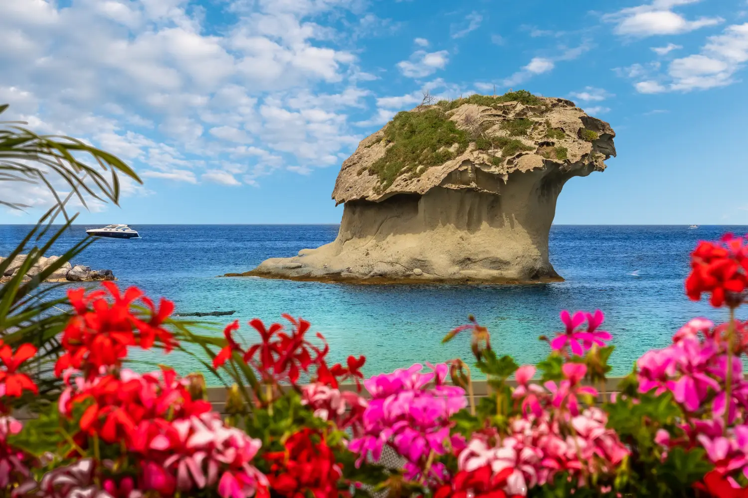 Ferry to Ischia - Landscape with Il Fungo of Lacco Ameno, coast of Ischia island, Italy.