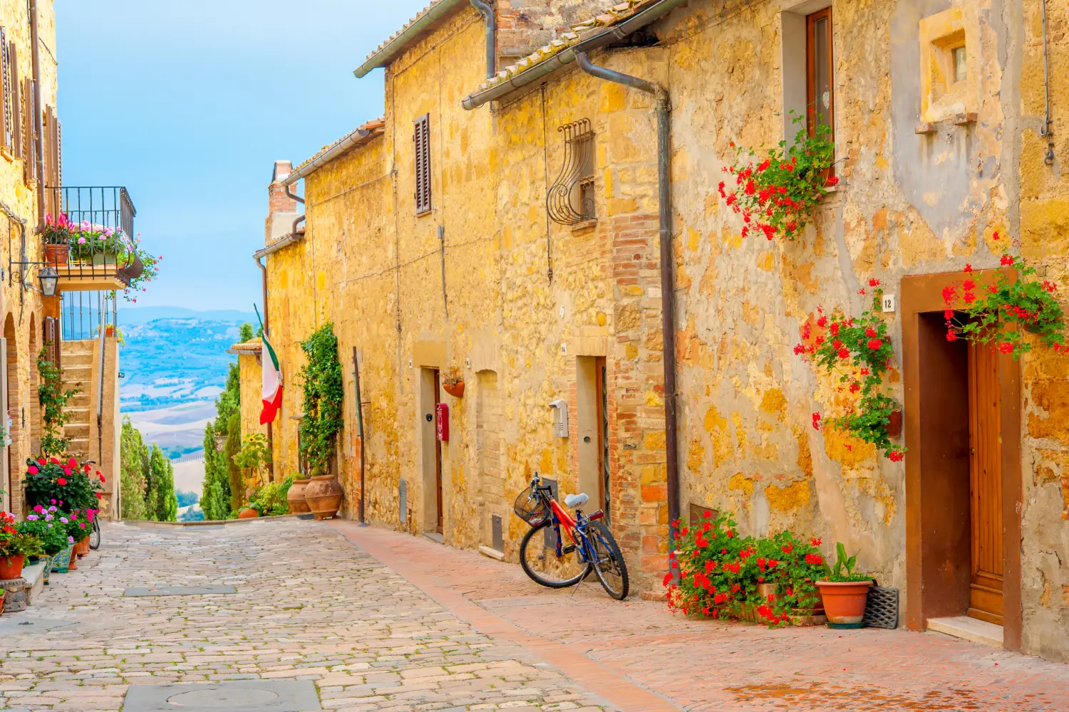 Ferry to Livorno - A street in the beautiful little village of San Gimignano with a view of the Tuscan valley, Italy, Europe.