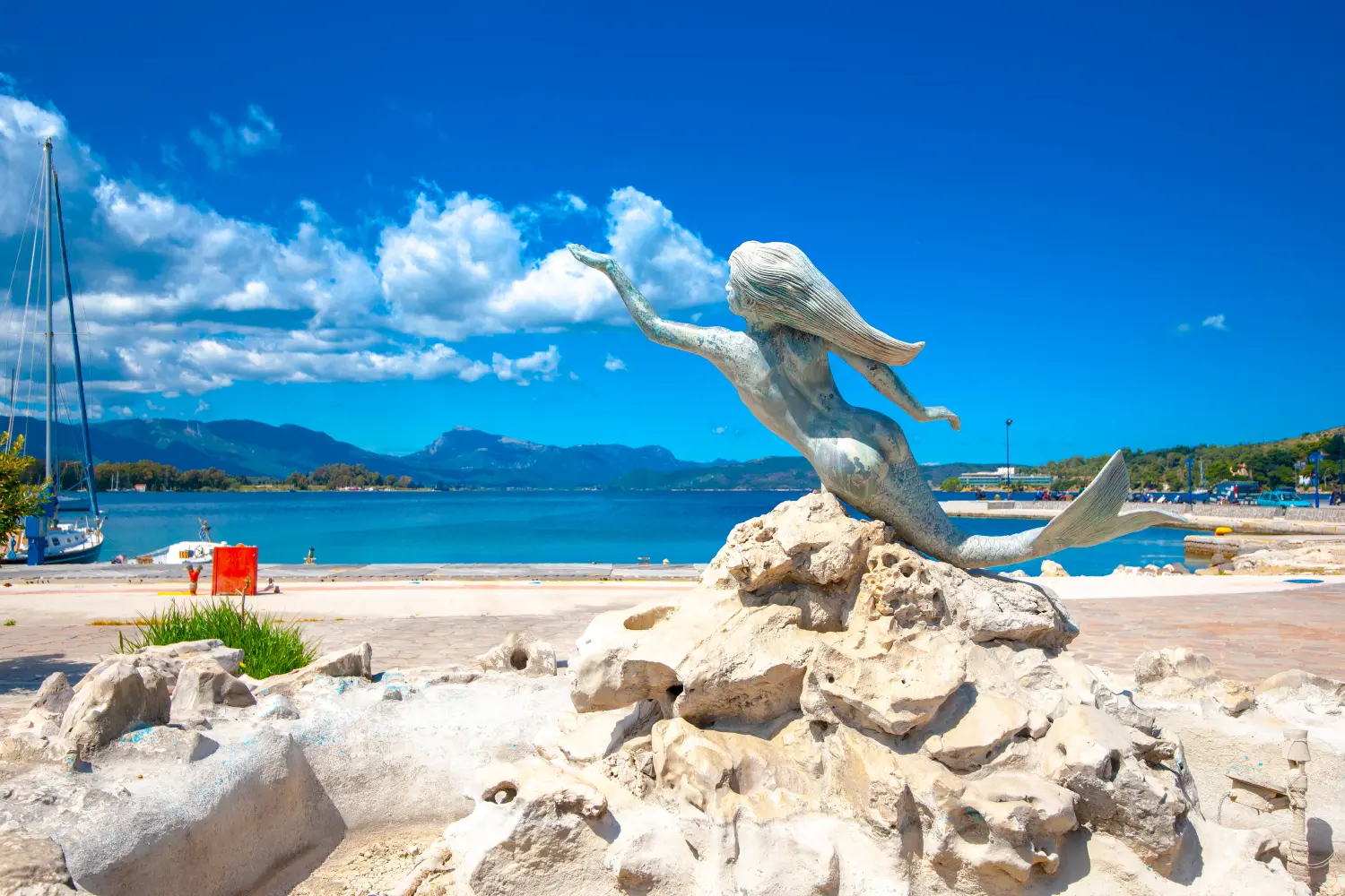 Ferry to Poros - beautiful sculpture of a mermaid in Poros island in Greece.