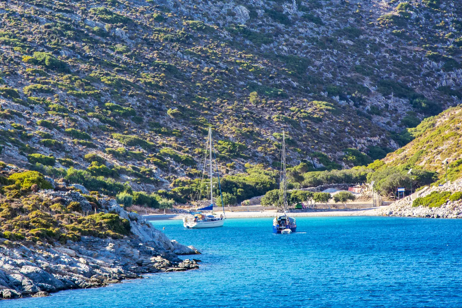 Ferry to Agathonisi - Yachts on the beach in Agathonisi Island in Greece.