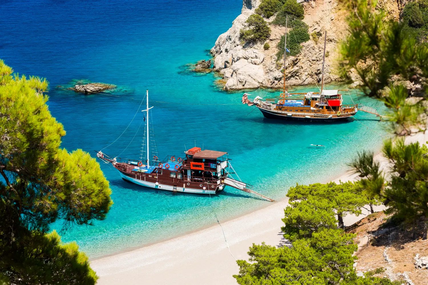 Ferry to Karpathos - Beautiful Apella beach hidden between high mountains in Karpathos island. Greece.