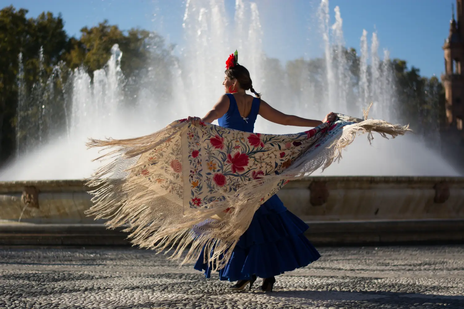 Ferry to Spain - Beautiful woman dancing flamenco near the fountain.