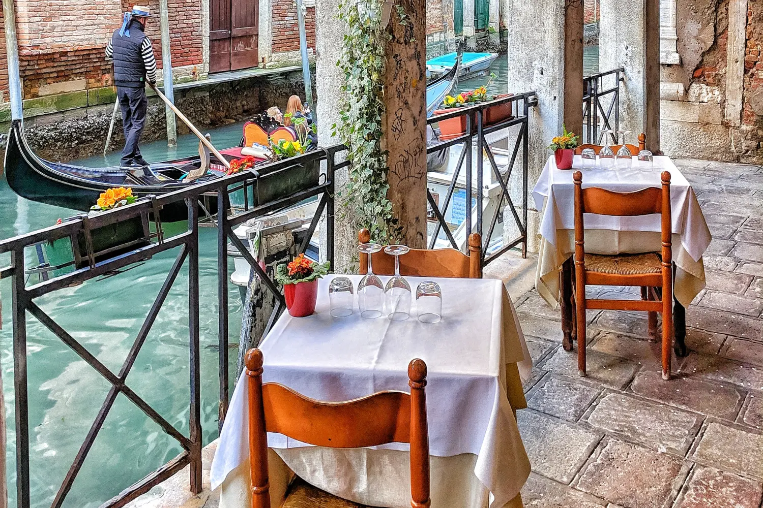 Italian Island ferries - Romantic restaurant alongside the canal of Venice