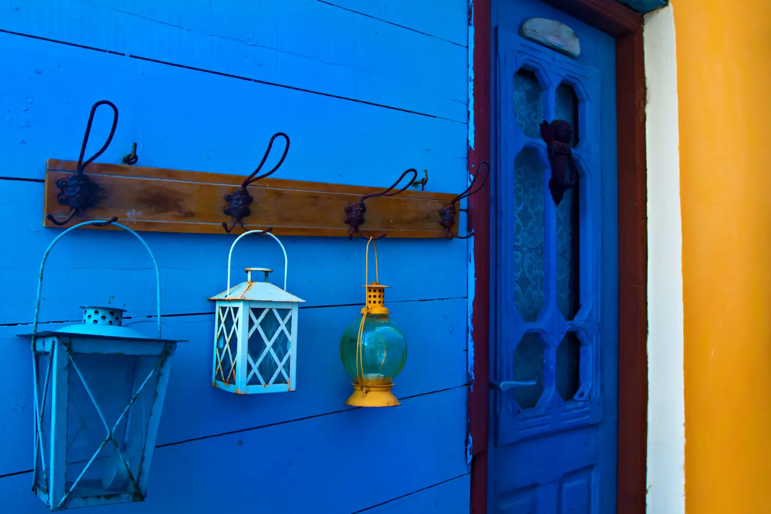 Ferry to Samos - Samos island. Greece. Samos Kokkari Village. Colorful wall and blue, white, yellow lanterns.