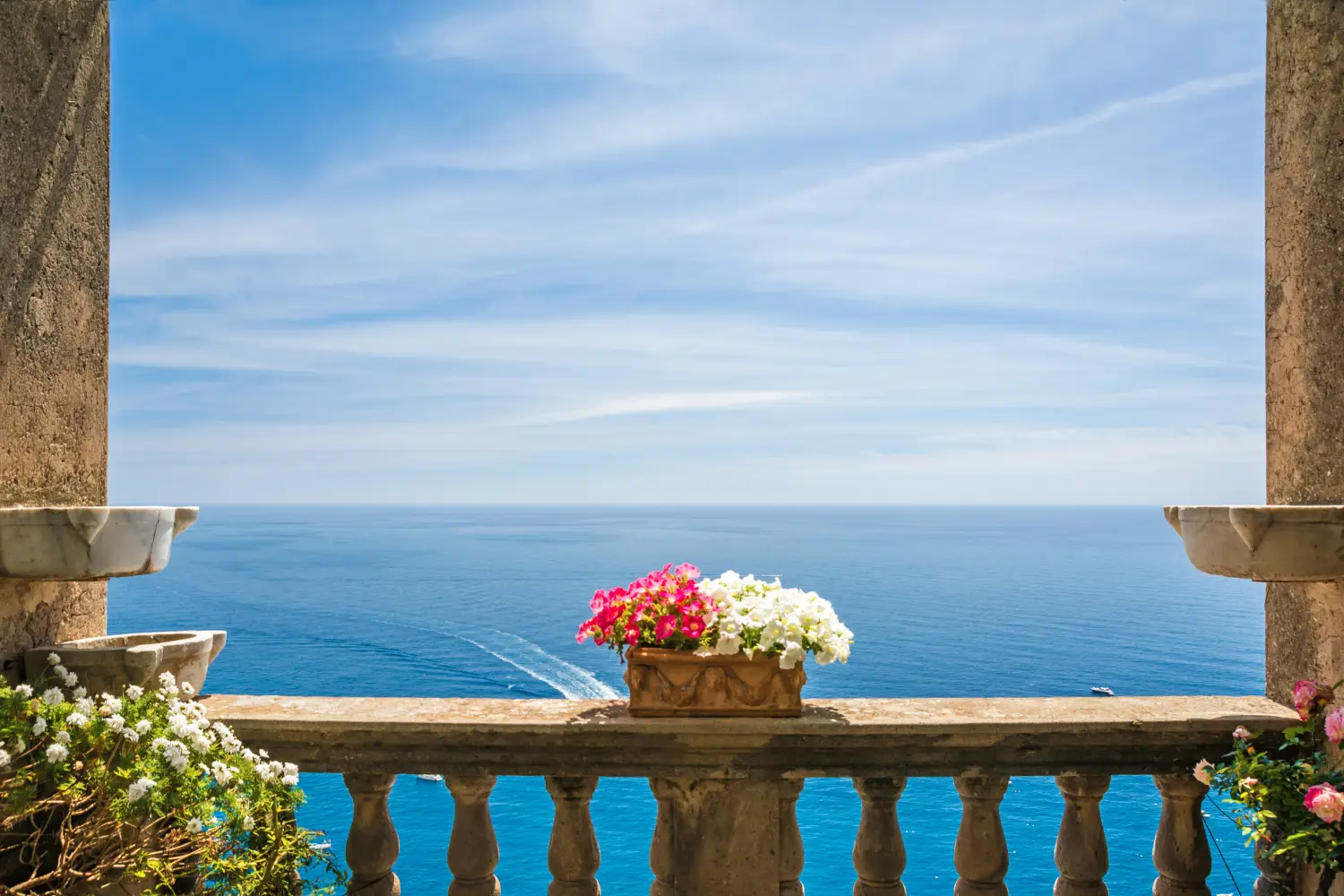 Ferry to Positano - Beautiful sea view in the town of Positano from antique terrace with flowers, Amalfi coast, Italy. balcony with flowers.