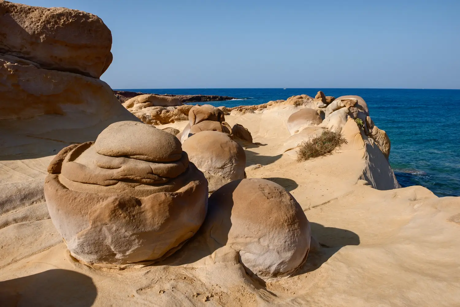 Ferry to Mirina - Sculptures made of Lava at the geological park of Faraklo in Lemnos Island.