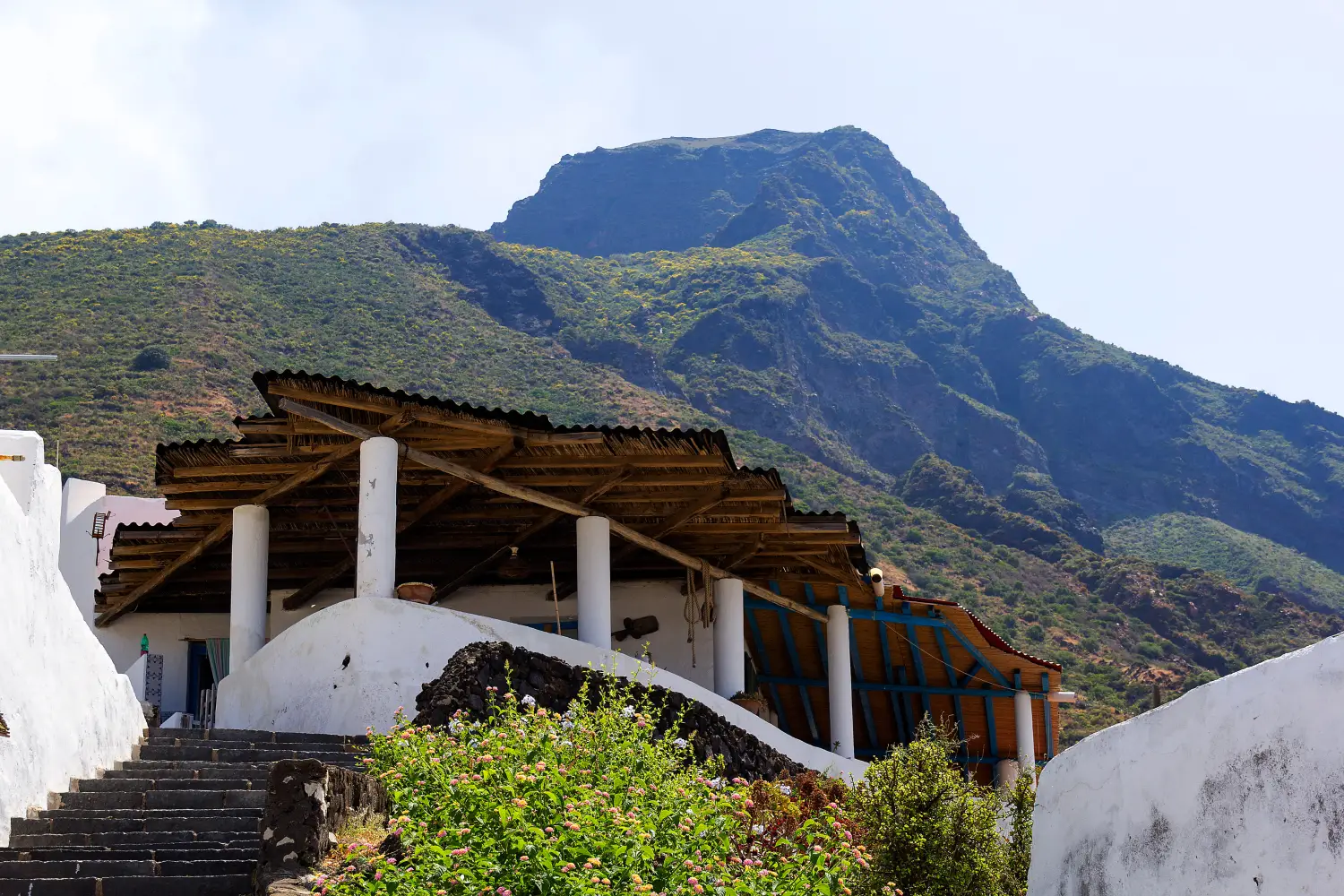 Ferry to Ginostra - The ginostra house and the volcano.