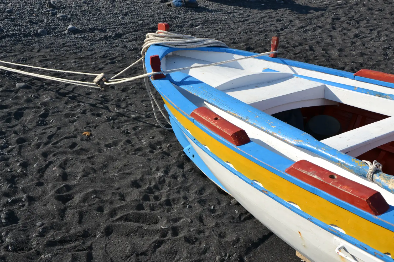 Ferry to Stromboli - A colorful fishing boat on the black beach of Stromboli Island.